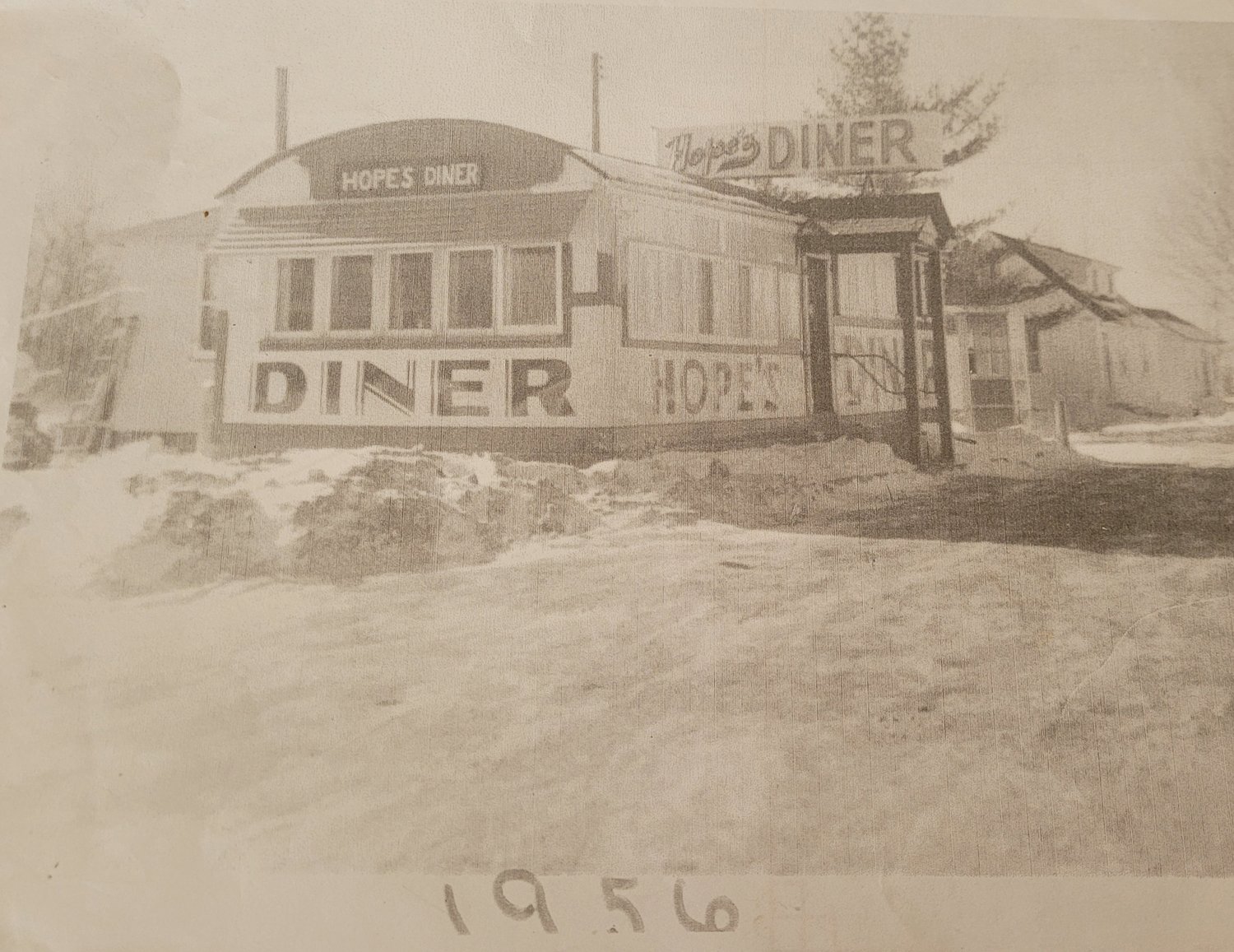 Sally was working as a waitress in her family’s diner more than 60 years ago when she first met her husband. Her family owned Hope’s Diner, on Route 6 in Foster, and her future husband stopped in to order Sally’s mother’s beef stew. This photo shows how the diner appeared in the mid-1950s, just before Sally met Earl over a hot bowl of stew.